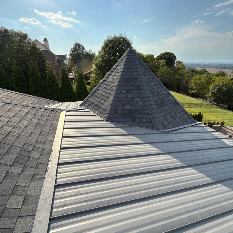 Roof shingles and metal roof panel inspection on turret