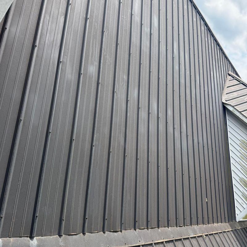 Metal roofing panels with hail damage inspection