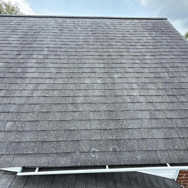 Asphalt shingle roof with hail damage markings