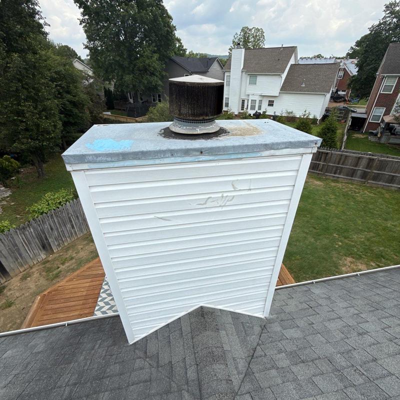 Chimney siding and cap with roof shingles