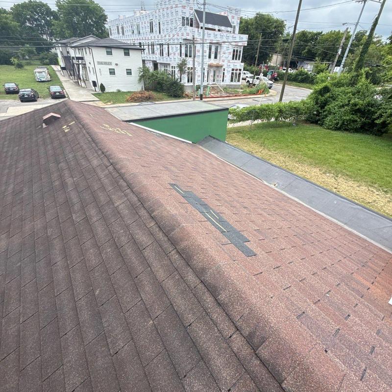 Roof shingles with hail damage and wear