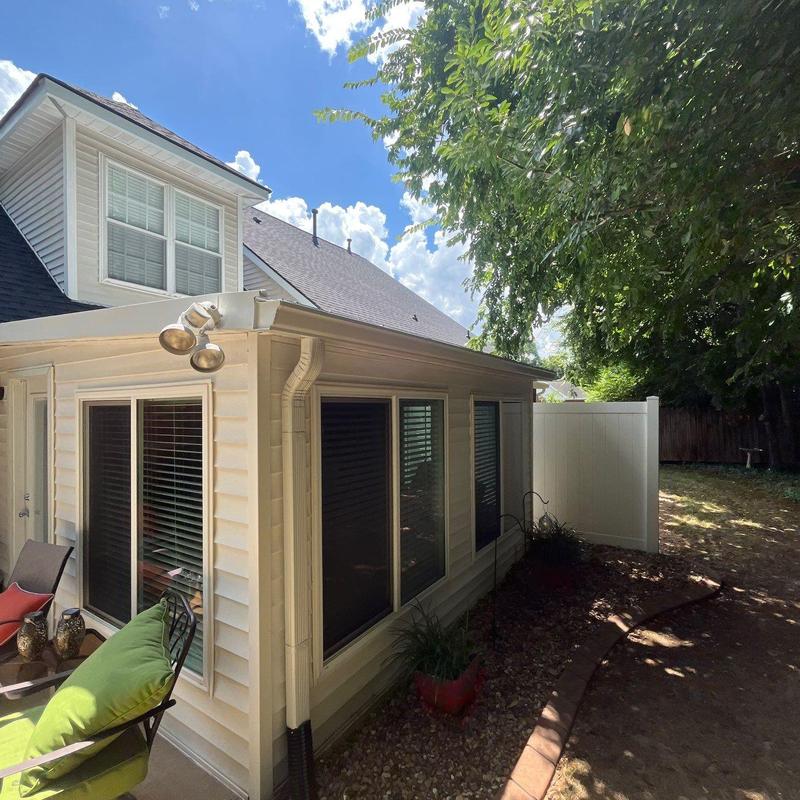 Gutter and downspout system on house exterior