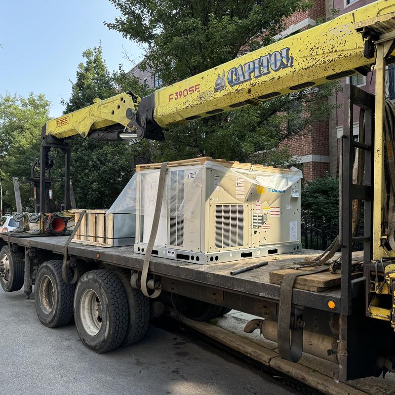 Packaged rooftop AC unit on flatbed truck