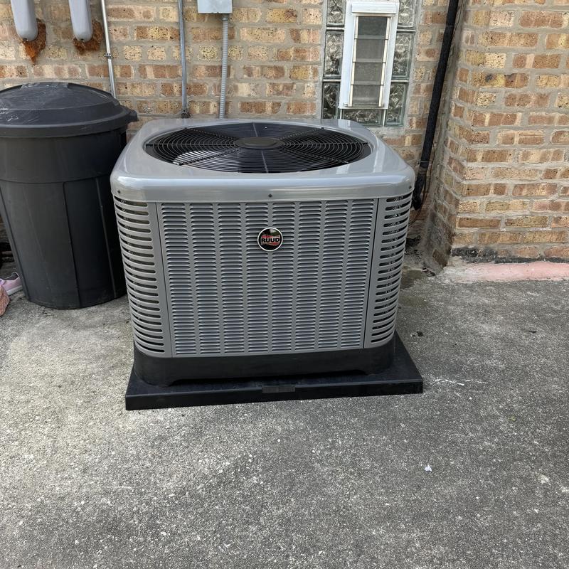 Ruud 14 SEER air conditioner unit on concrete pad