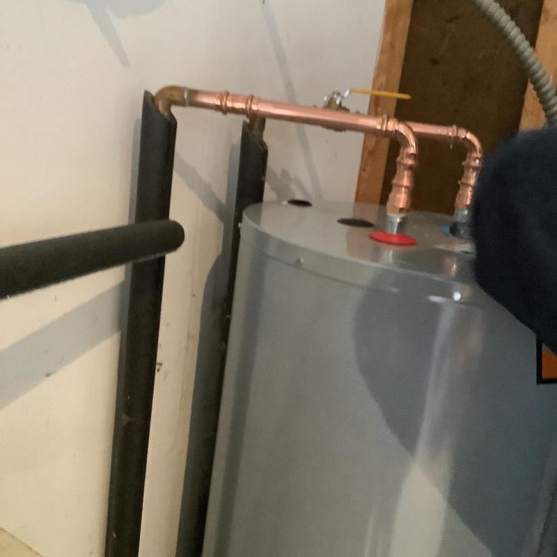 50-gallon electric water heater with copper piping installation