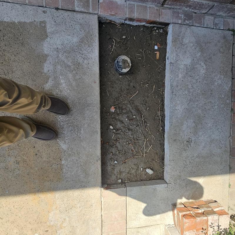 Sewer line cleanout excavation and concrete removal