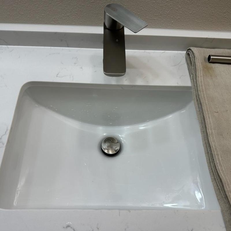 Sink drain pop-up assembly with Delta stopper