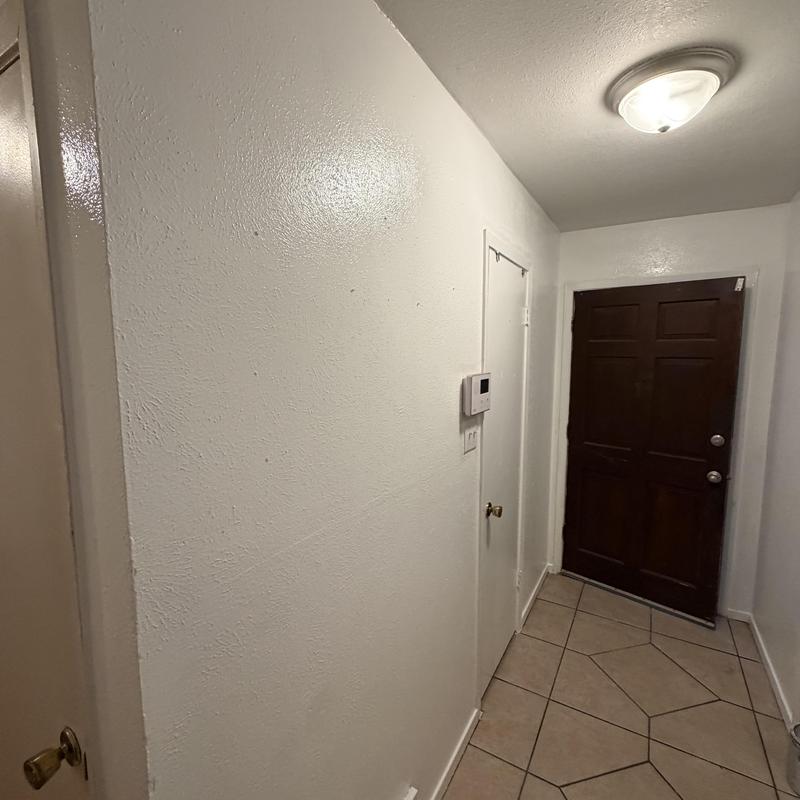 Sheetrock wall with fresh texture and paint in hallway