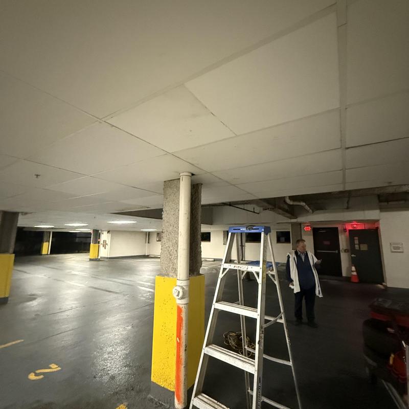 Main line pipe and basement parking area with ladder Main line pipe and basement parking area with ladder