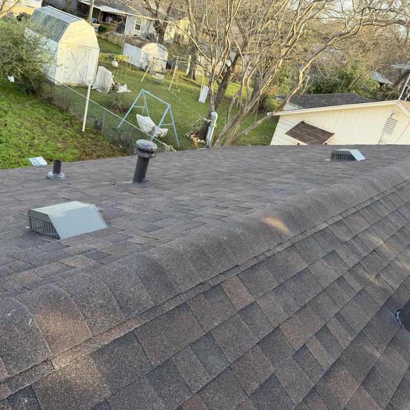 Brown wood Owens Corning architectural roof shingles installed