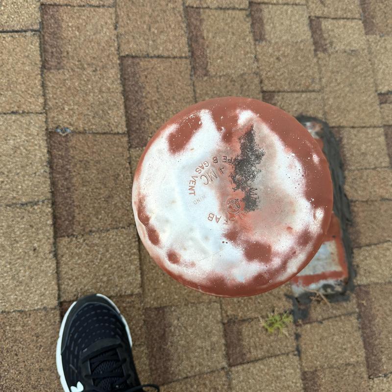 Roof vent with corrosion on shingle roof in Fort Worth