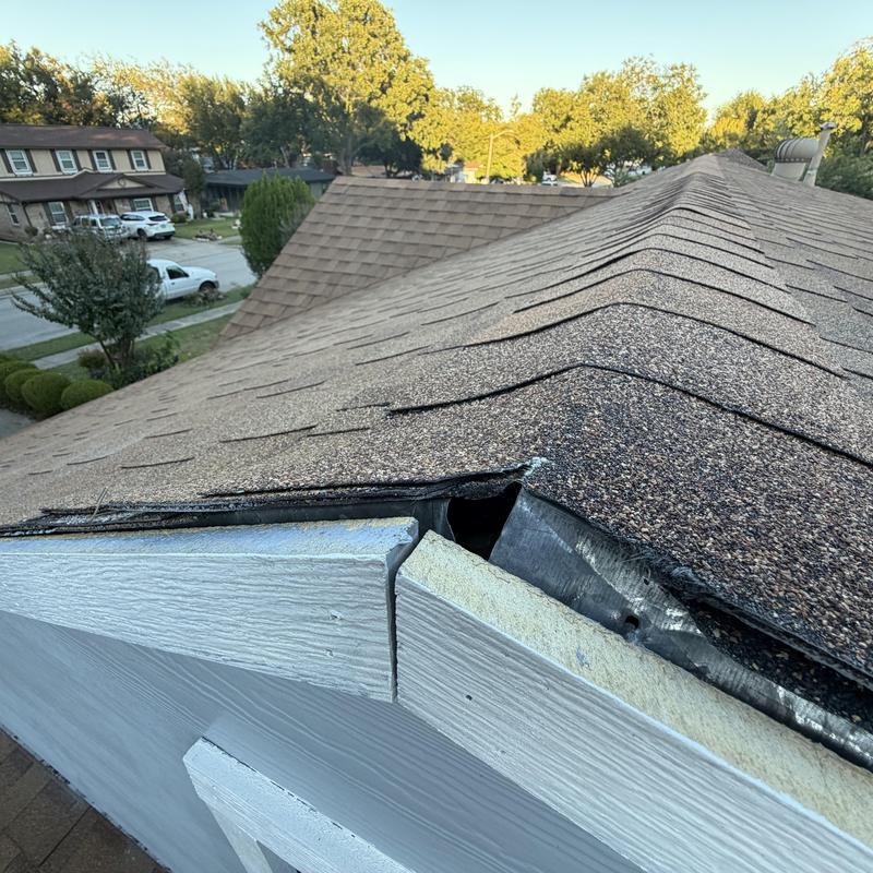 Roof shingles and edge damage on residential home