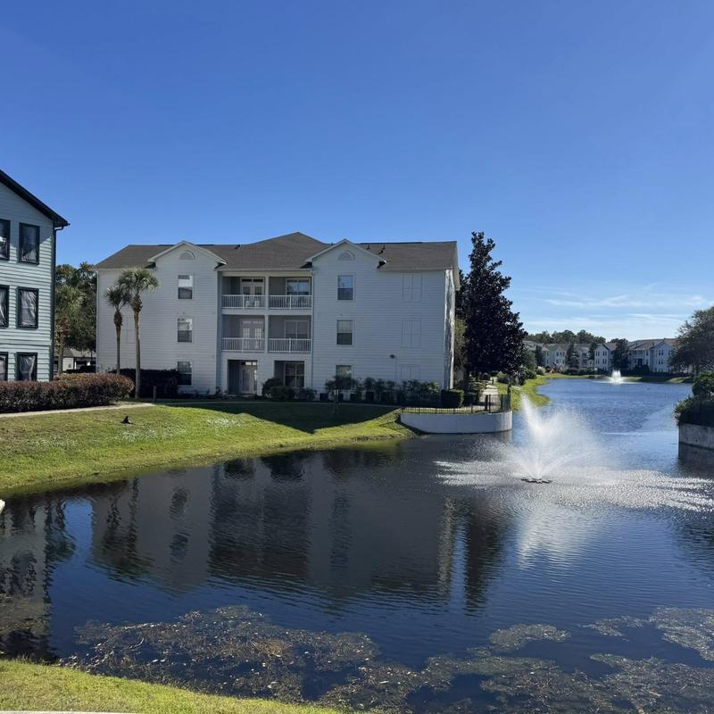 Asphalt shingle roof on white apartment building