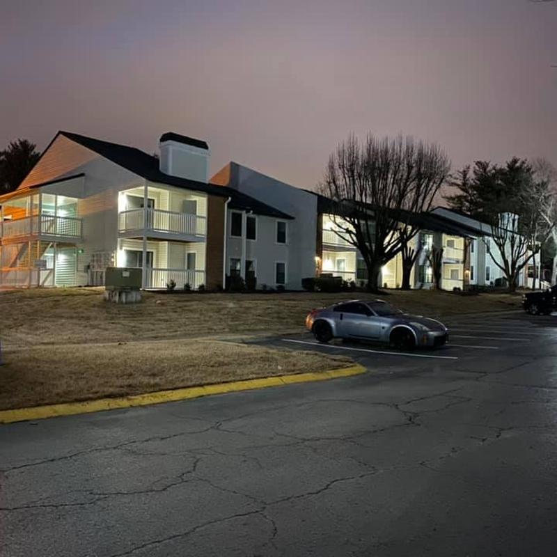 Asphalt shingle roof on apartment complex at dusk