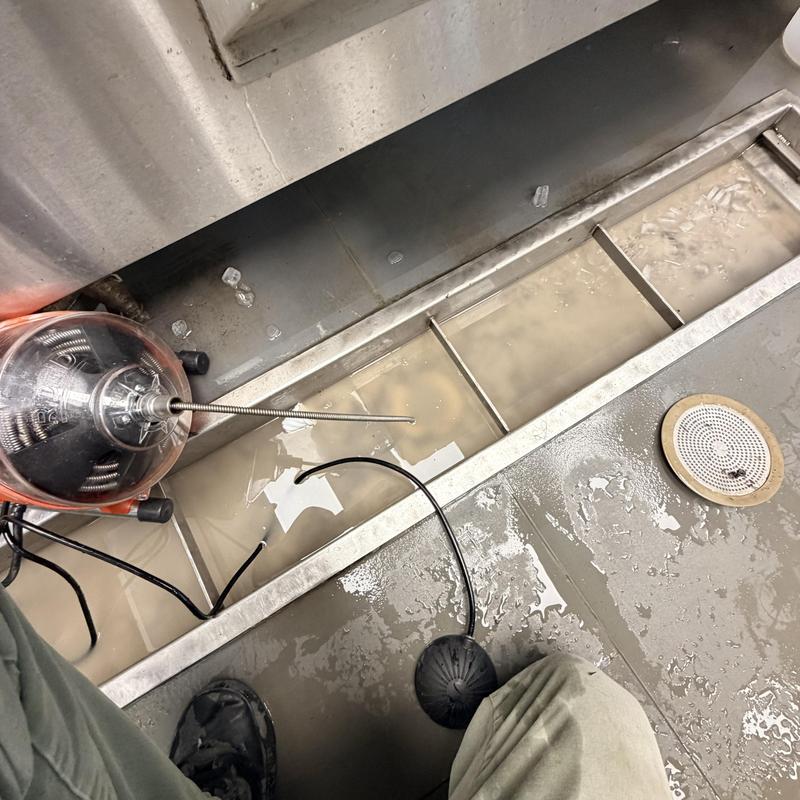 Mainline sewer drain clearing with electric auger tool