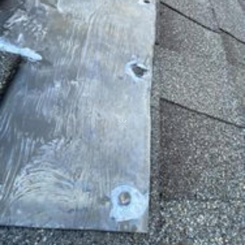 Roof flashing with worn sealant and exposed fasteners