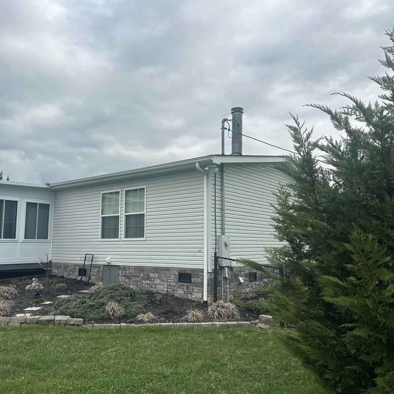 Vinyl siding and stone veneer on house exterior