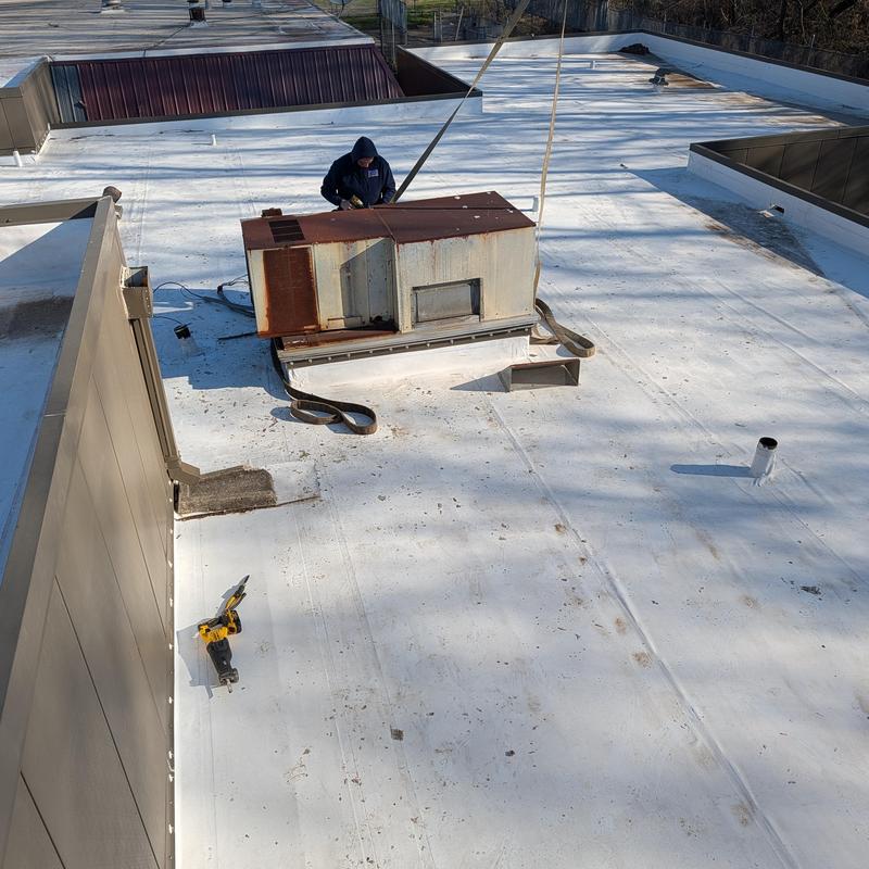 Old rooftop AC unit removal on PVC membrane roof