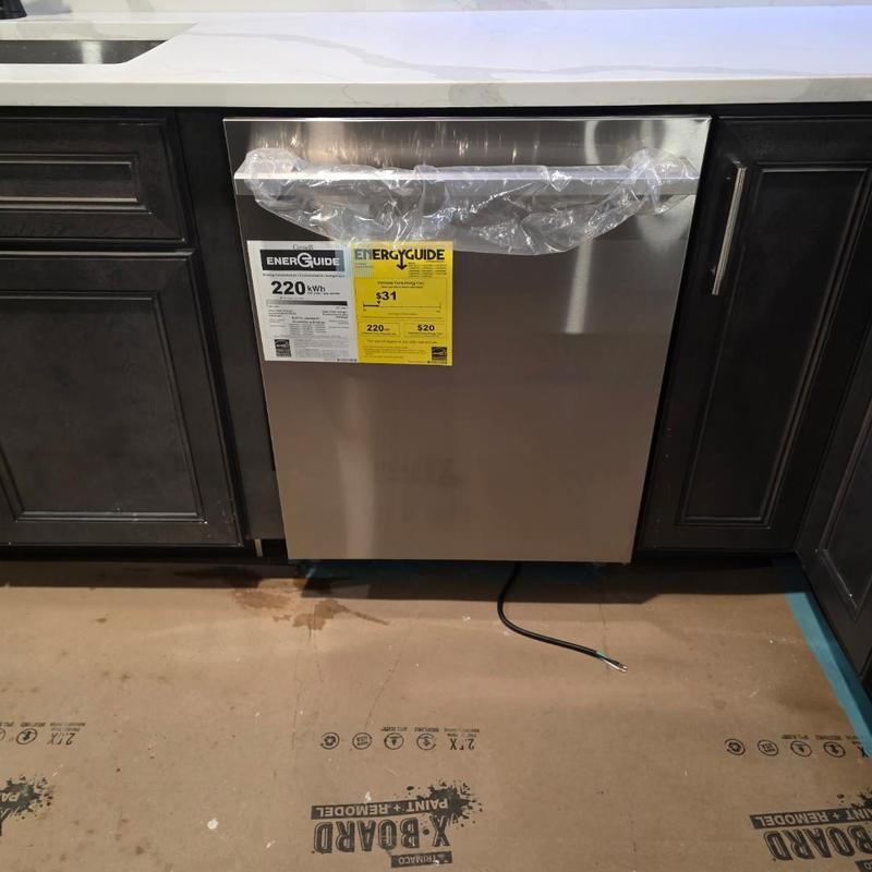 Dishwasher installation with protective plastic cover