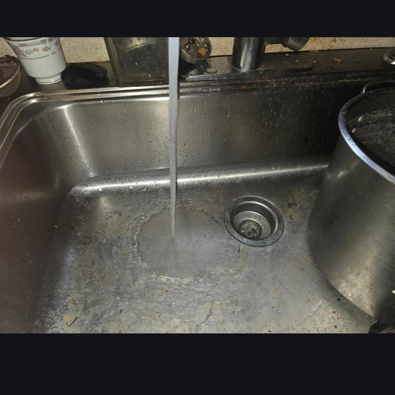 Kitchen sink drain flowing after grease blockage clearing