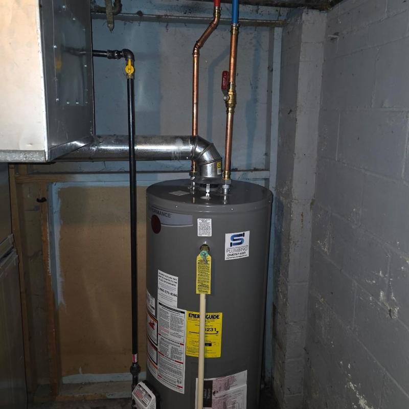 50-gallon water heater with repiped venting in basement