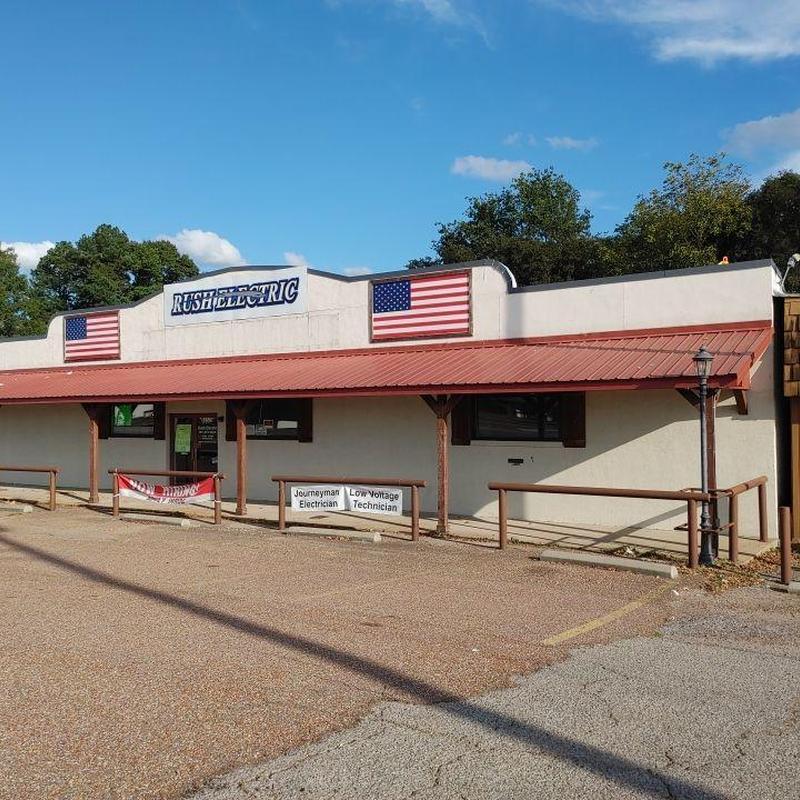 Metal roof and building exterior with flags and signage