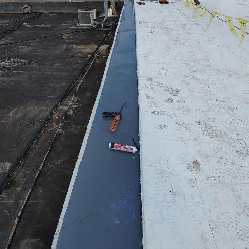 Single ply TPO roofing edge with tools and sealant