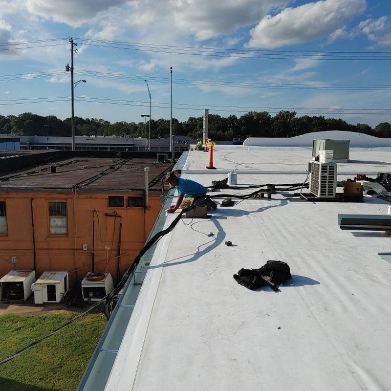 Single ply TPO commercial roof installation in progress