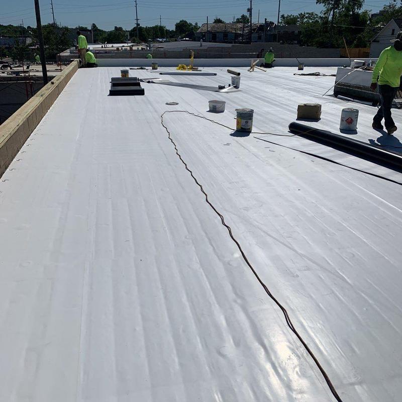Single ply TPO roofing installation on commercial roof