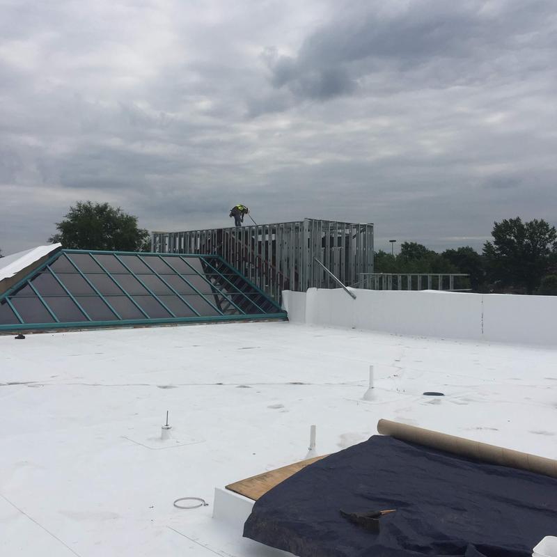 Single ply roofing installation on commercial gym roof