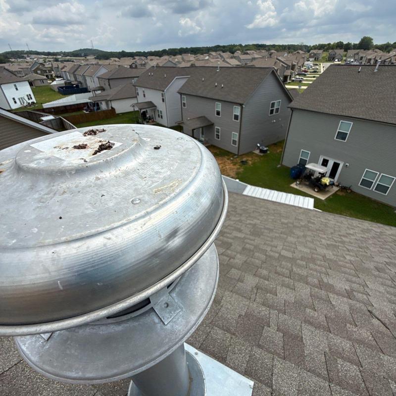 Roof attic ventilation turbine on shingled roof
