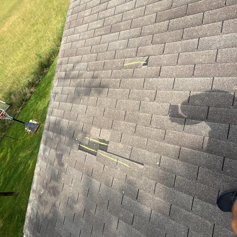 Architectural roof shingles with hail damage marks