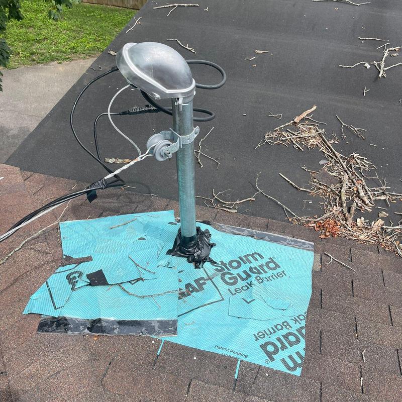 Roof vent flashing with leak barrier on shingle roof