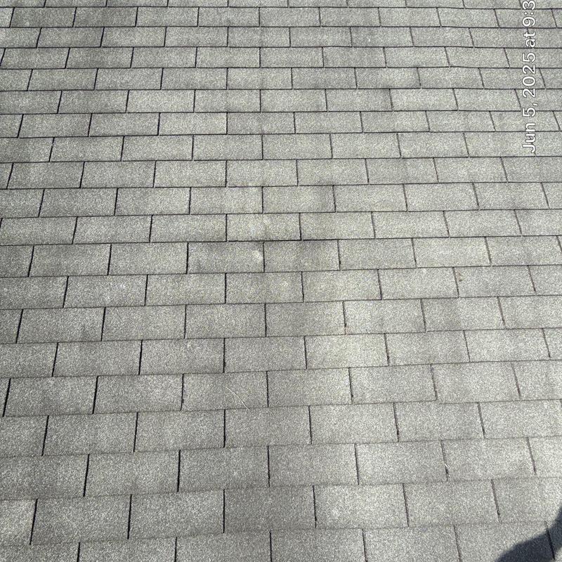 Roof shingles with hail damage and wear marks