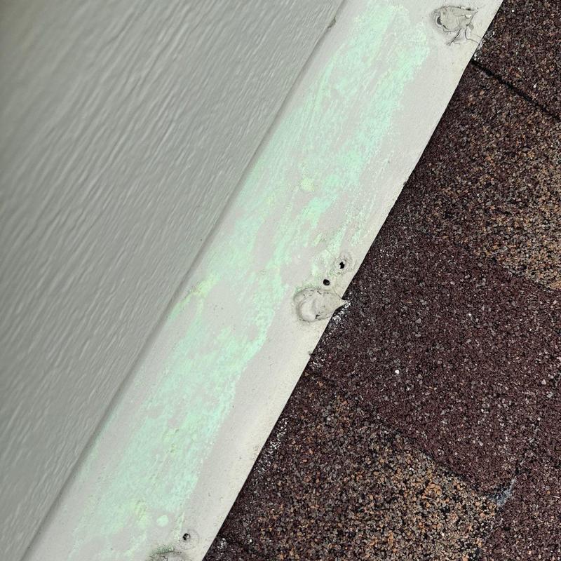 Roof flashing with hail damage and granule loss