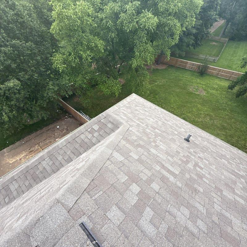 Asphalt shingle roof inspection with visible hail impact risk