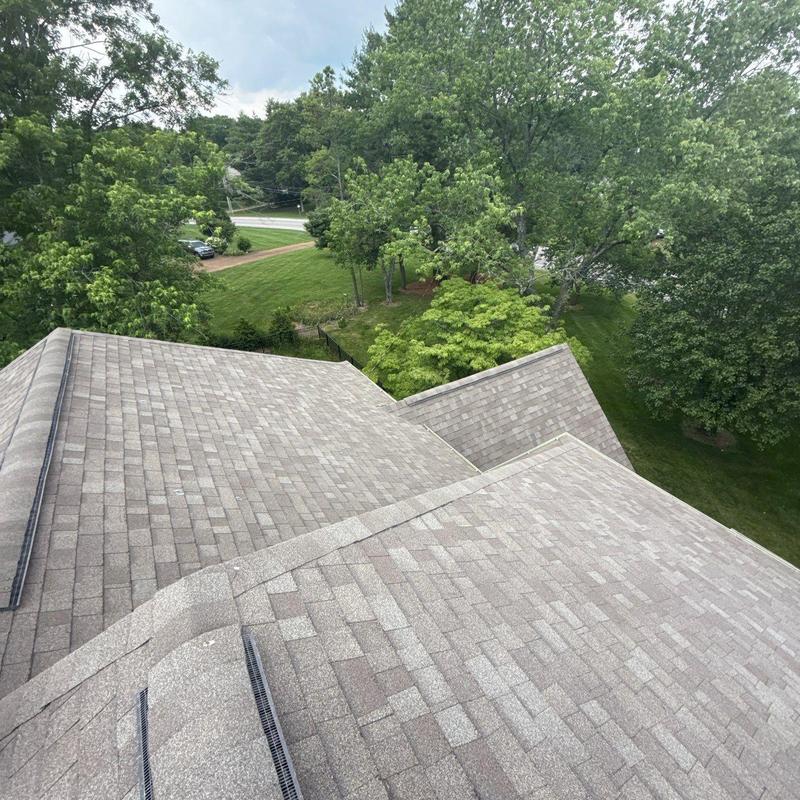 Asphalt shingle roof with hail damage and wear