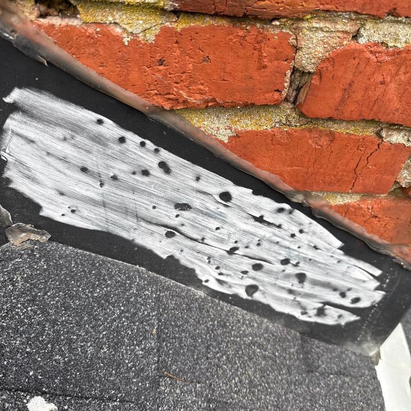 Flashing on brick wall with sealant applied and wear