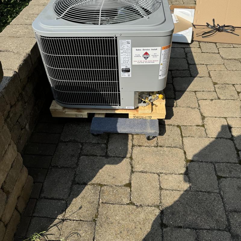 15 SEER Carrier air conditioner unit on pallet outdoors