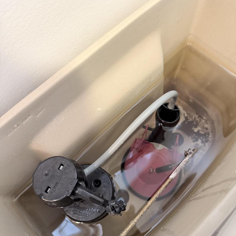 Toilet fill valve and flapper inside tank