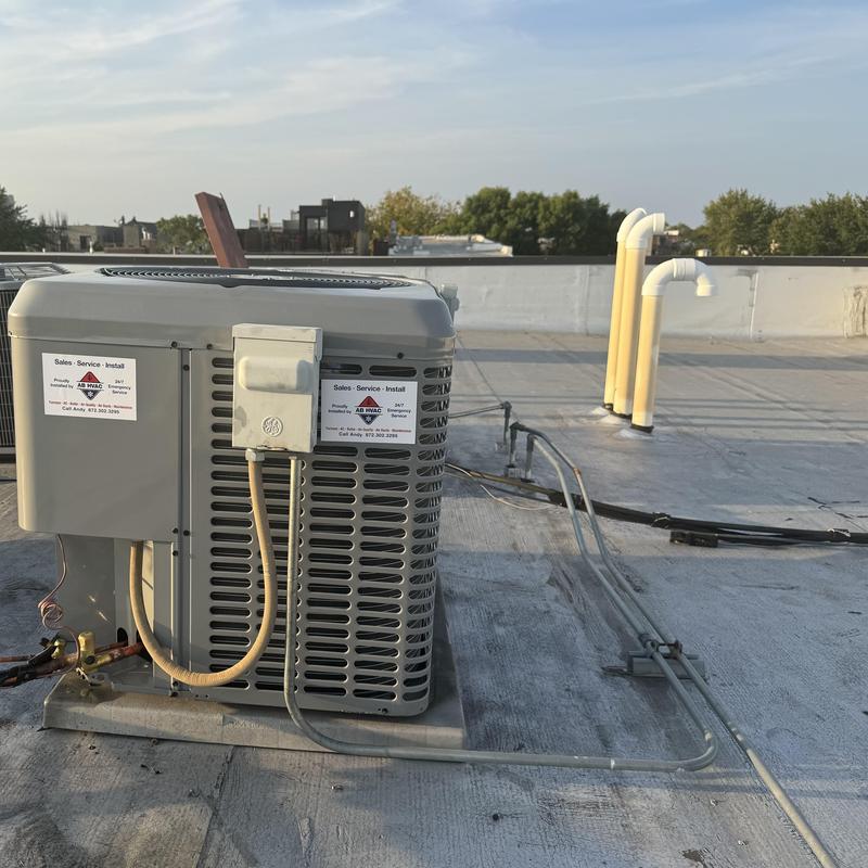 Luxaire 15 SEER air conditioner on rooftop unit
