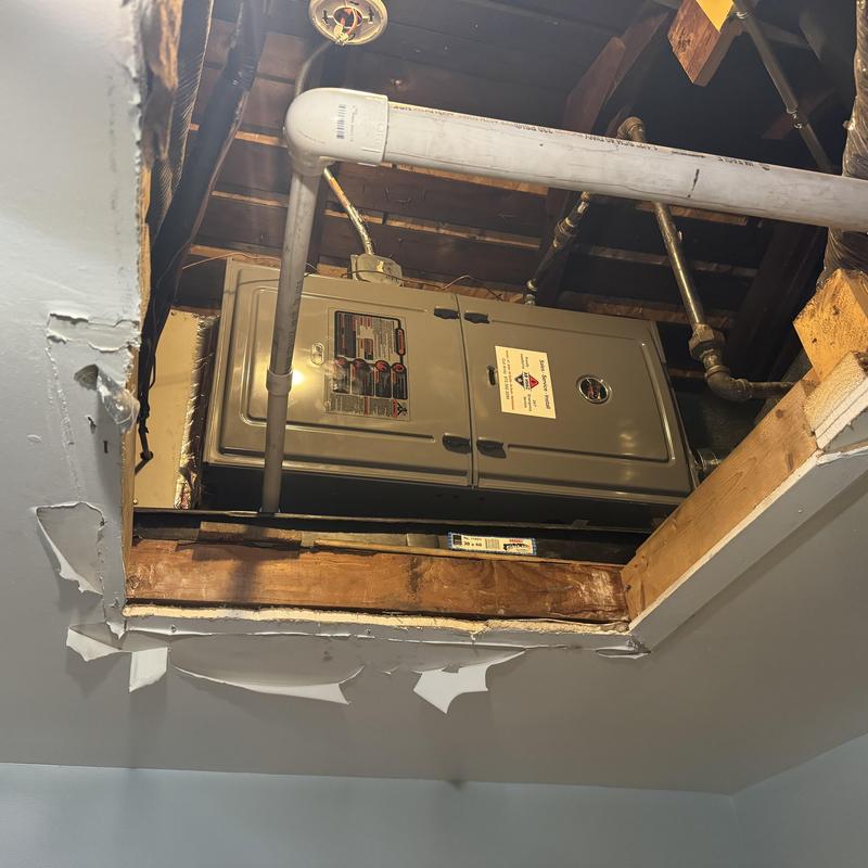 Gas furnace unit installed in ceiling access panel
