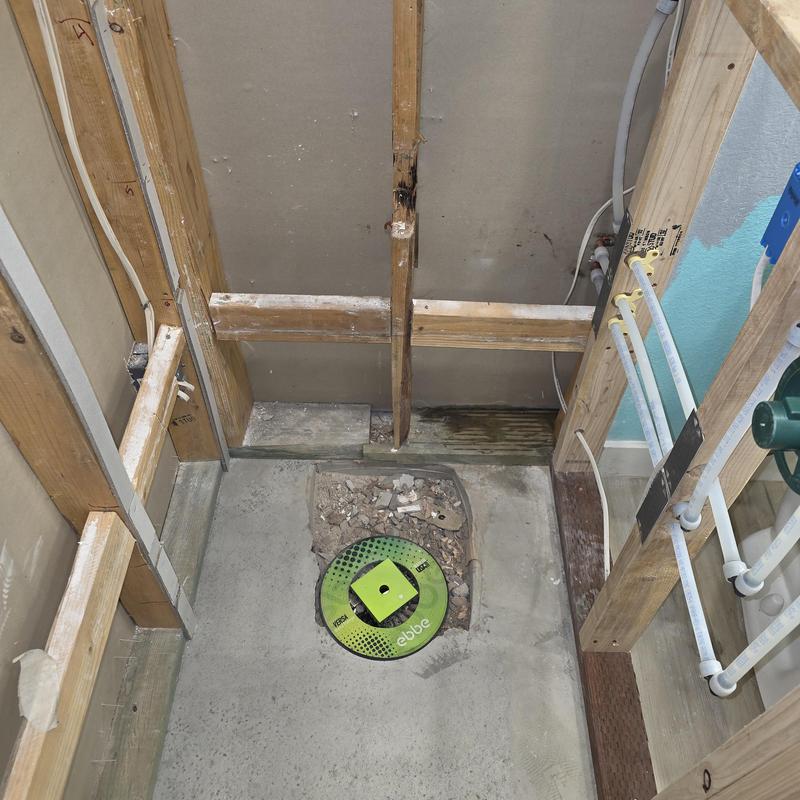 Shower drain piping with valve and framing exposed Shower drain piping with valve and framing exposed