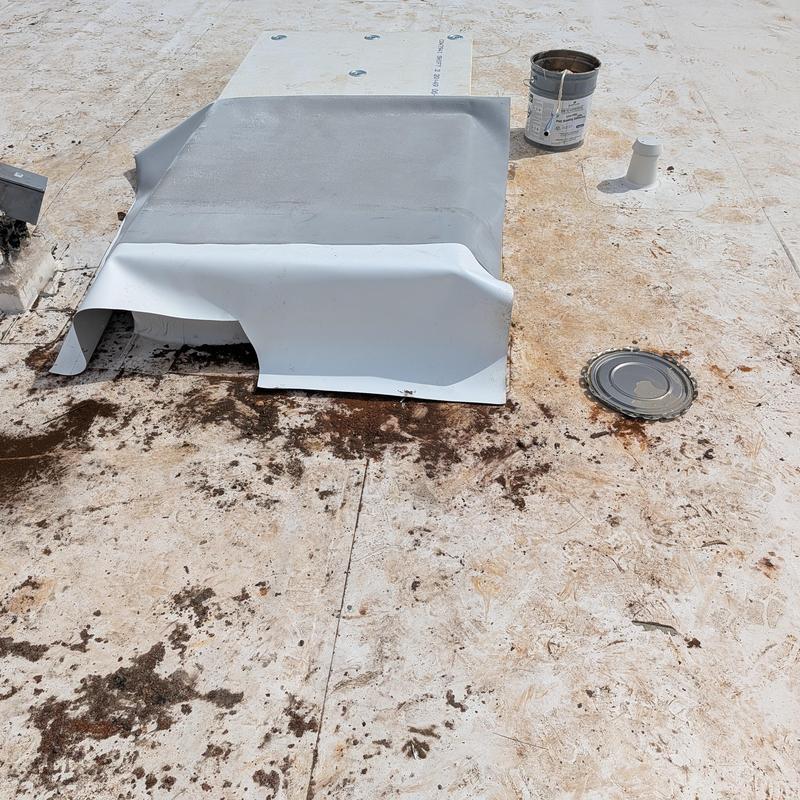 PVC single ply roofing membrane being installed on roof