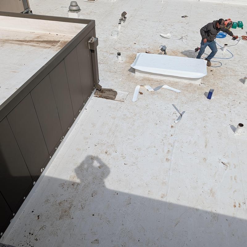 PVC Single Ply roofing installation over removed AC units