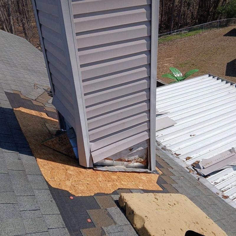 Chimney flashing and siding repair on roof