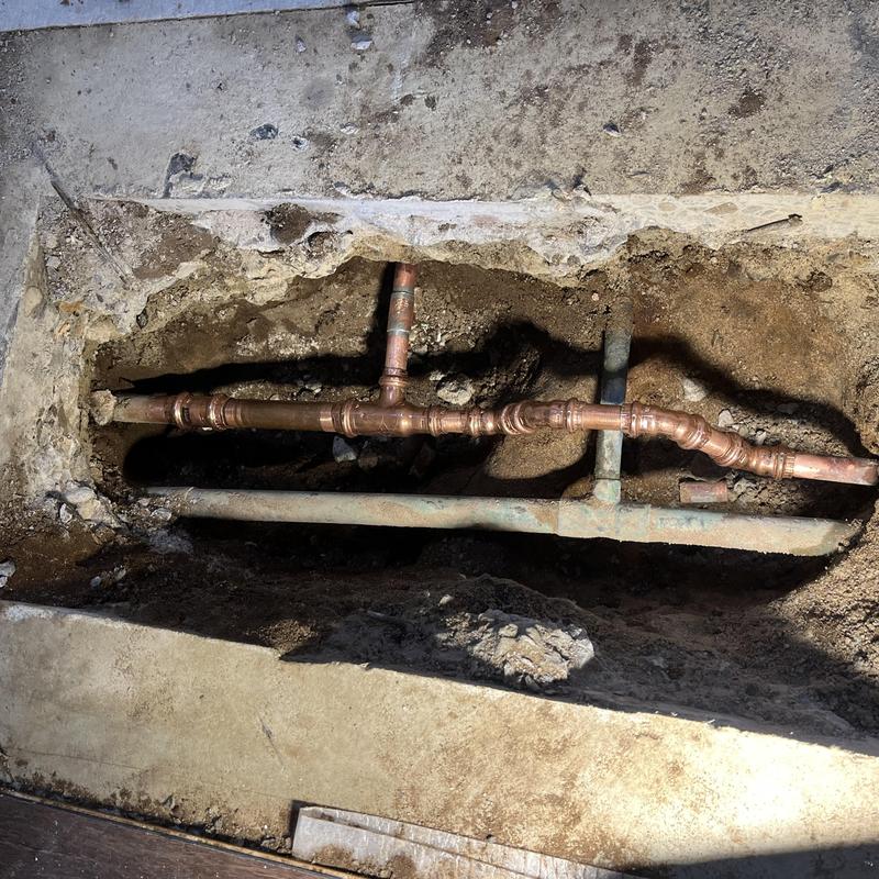 Copper hot water pipe in concrete slab leak repair