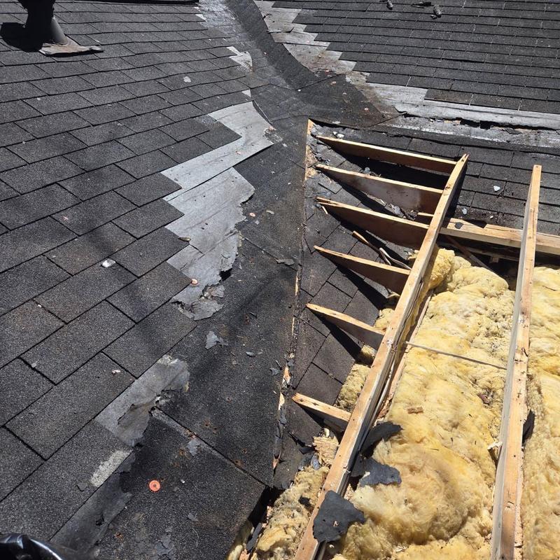 Roof decking and valley flashing with damaged boards removed