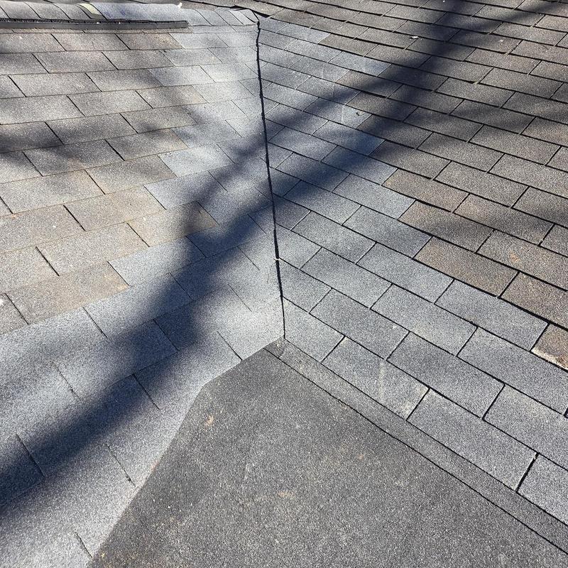 Roof valley flashing with asphalt shingles and flat roof section