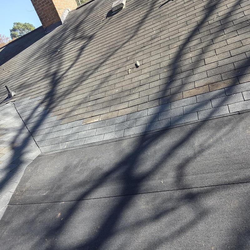 Flat roof replacement with new asphalt shingles and flashing